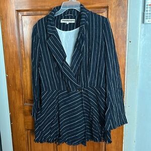 Free people blazer. Buttons on sleeve. Button closure at waist. Fringe detail.